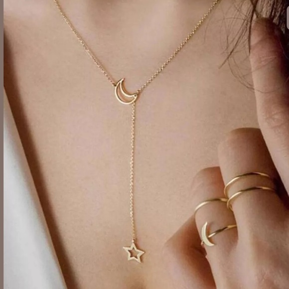 Jewelry - NWT • gold star and moon necklace Jewelry - NWT • gold star and moon necklace